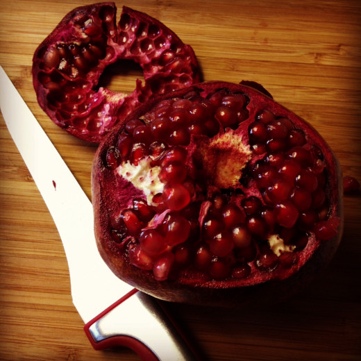 Pull the "lid" off the pomegranate and set it aside.
