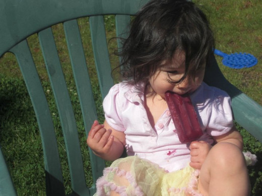 My toddler eating a popsicle.