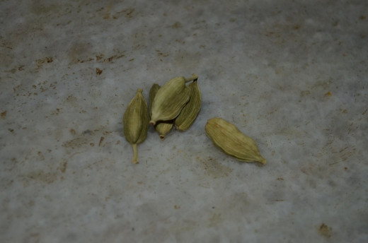 add 3 or 4 cardamom after tearing the same into the jaggerry while boiling