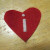 Position and sew the cut out design to the smallest piece/red heart. Position and sew the cut out design to the smallest piece/red heart.
