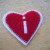Sew the smaller front piece/red heart to the larger back piece/white heart. Sew the smaller front piece/red heart to the larger back piece/white heart.