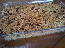 After the Rice Krispie mixture has cooled a little mix in your chocolate chips and pour into a greased casserole dish.