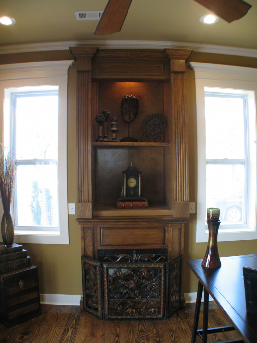 This small gas fireplace insert had the mantle already attached.  Shelving was installed above for added height.
