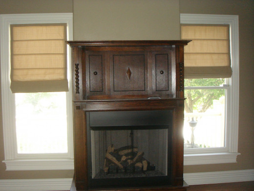 AFTER A gas fireplace box to house the antique mantle makes this den warm and cozy.