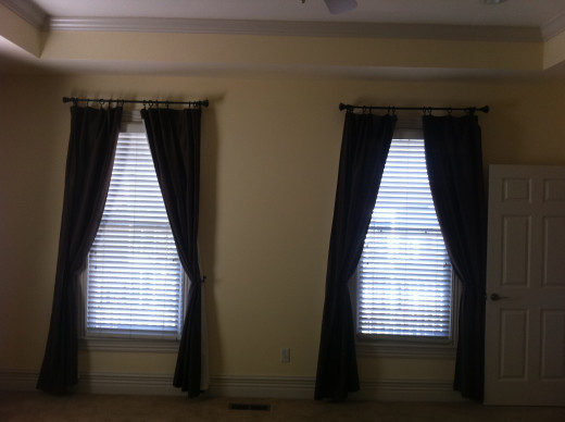 BEFORE Small wall space between windows in master bedroom.