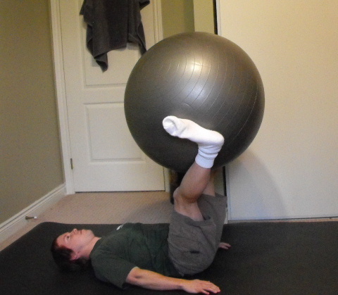 Me doing leg lifts with an exercise ball.