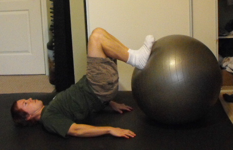 Me doing hamstring curls with a stability ball.