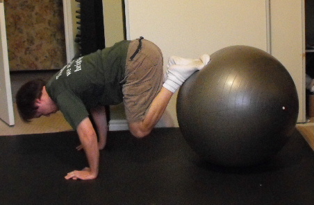 Me doing knee tucks on my exercise ball.