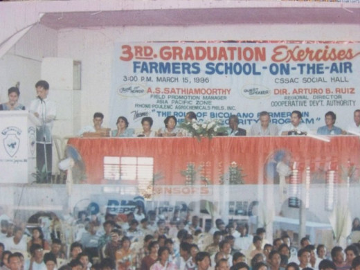 Travel Man as emcee on the Graduation Ceremonies of School-on-the-Air for farmers in Camarines Sur (Photo Source: Ireno Alcala)
