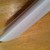 Adjust the overlap on the back of the candy bar and lightly crease the folded sides. Adjust the overlap on the back of the candy bar and lightly crease the folded sides.