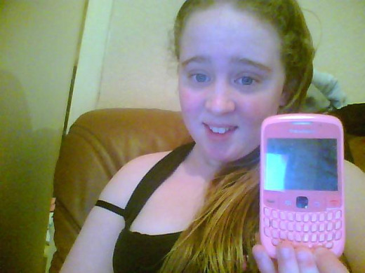 My Daughter Jennifer shows off her Cell Phone. It had to be pink or we would have had to return it to the store.