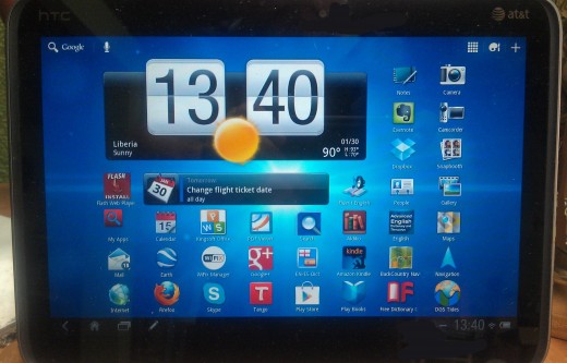 The central, or home screen, of the HTC Jetstream with the standard background theme.  Apps, personalizion options and widgets are accessed in the upper right corner.  Settings and notices are accessed in the lower right corner. 
