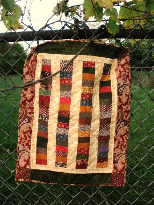 I added a small inner border to keep the outside coins from touching the outer border on this Chinese Coins quilt.