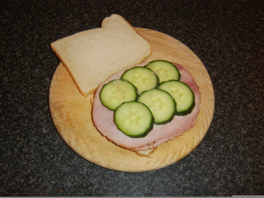 Cucumber is laid on hamd and seasoned
