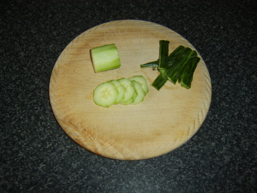 Cucumber is skinned before being very thinly sliced