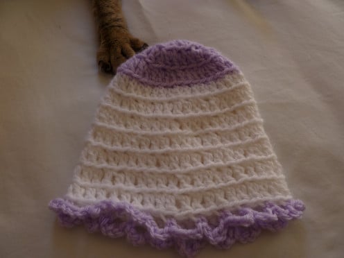 White basic beanie with lavender yarn used for first 3 rows and to create bottom edging