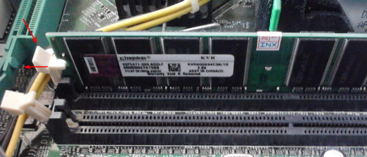 Memory slots, secured with levers; notice the empty slot