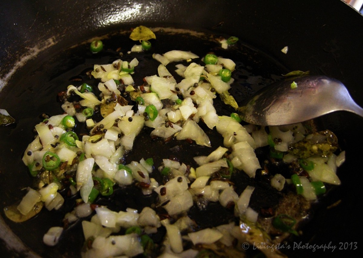 Sauteing onion and green chili along with dry curry leaves