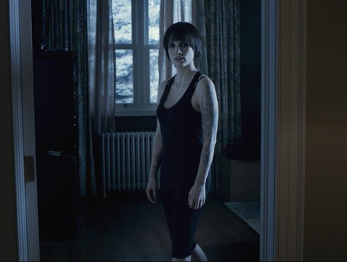 Jessica Chastain gets up to investigate strange noises in the dead of night in "Mama"