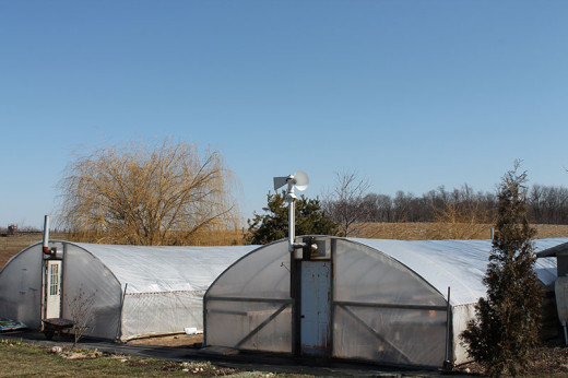 Amish Greenhouse equipped with air inflator to keep the plastic inflated.