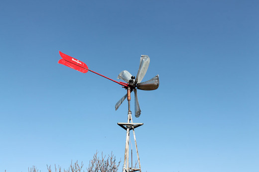Amish Wind Power Air Compressor pumps air into large storage tanks.