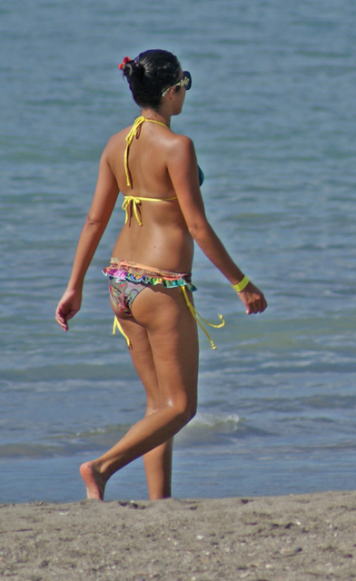 Lady walking on the beach, Playa Hermosa.