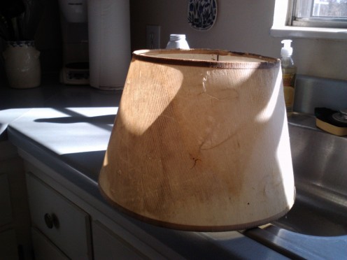 Stained and falling apart....this lamp shade needs replacing.