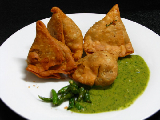 Samosas are a great introduction to Indian food - flaky pastry filled with a savory, spicy stuffing usually of potatoes and peas - delicious! 