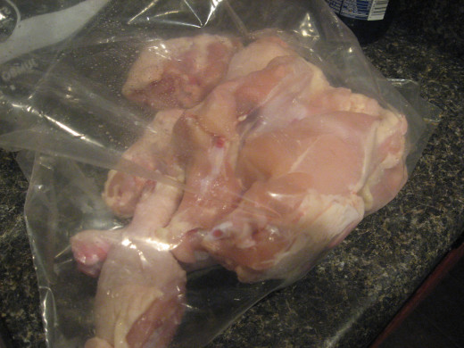Place rinsed and dried chicken parts in a large zippered food bag.