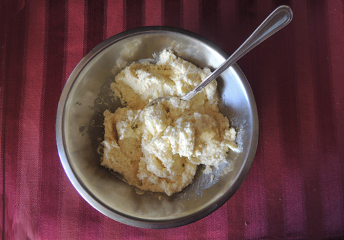 Process hulled garlic first, add cheeses, dash oil and butter...like butter! 