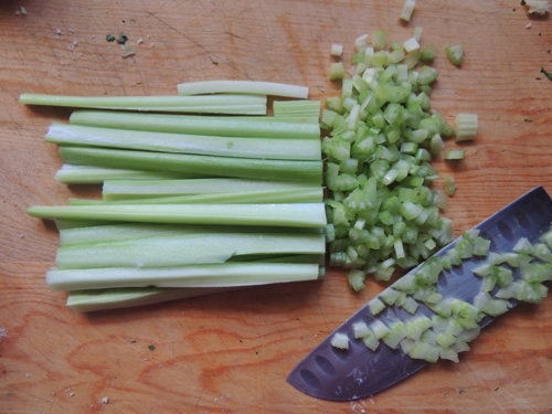 Dice celery by hand. Since shallots will be part of the mix, it's okay to food process these into a dice. Food processing WILL turn foods with high water content mushy, though...