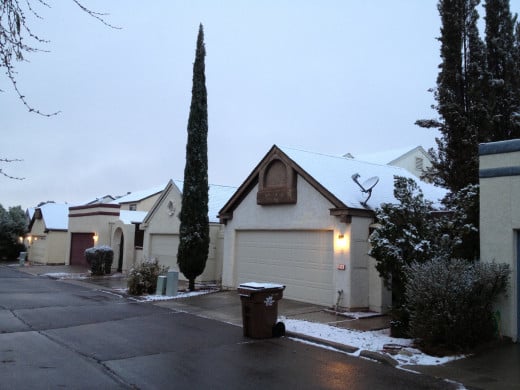 Snow covered roof tops and satellite dishes in my north Tucson neighborhood.
