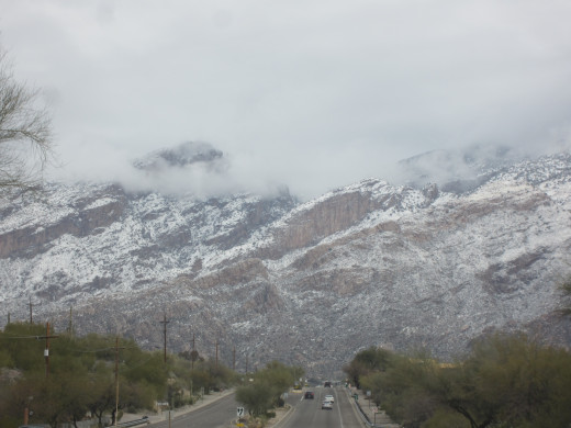 Clouds hugging Finger Rock in Tucson's Santa Catalina Mountains as one approaches mountains on Swan Road.