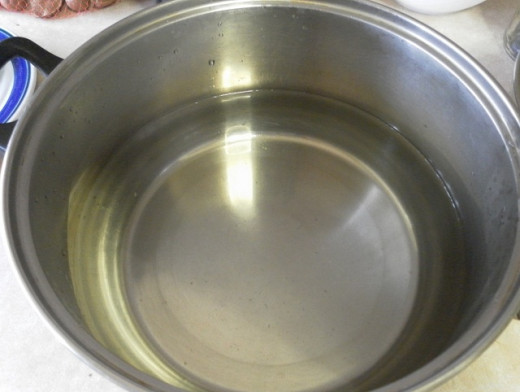 pot of warm water for soaking the rice paper