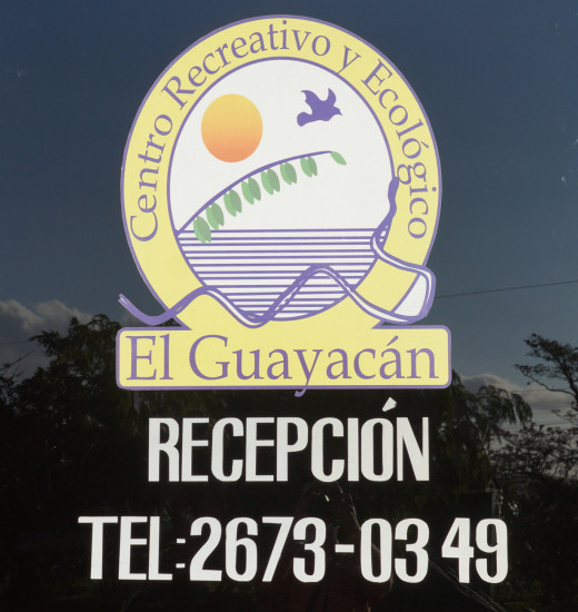 The El Guayacán sign at the reception desk.  Rooms and cabins are available.  