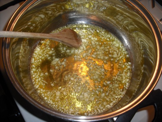 Sauté garlic in olive oil over medium heat
