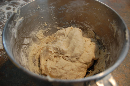 dough should be rather stiff after you have added 2 1/2 cups more of flour, turn it out when it looks like this