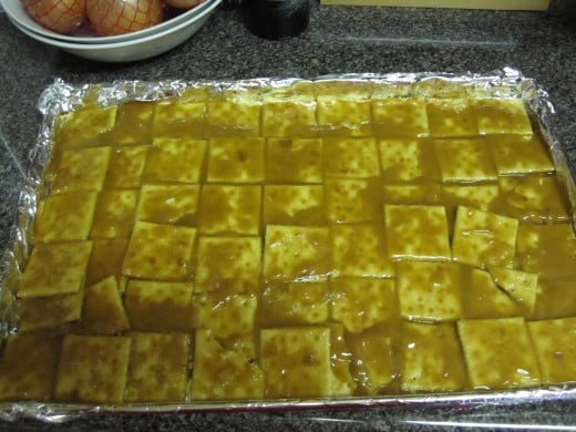 Carefully pour the liquid caramel over crackers, but don't be too slow about it. As soon as it leaves the hot pan it will start to thicken and get harder to spread.