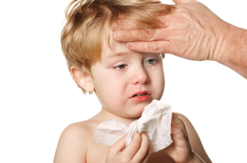 use your hand to feel the brow of a sick child to see if he has a fever