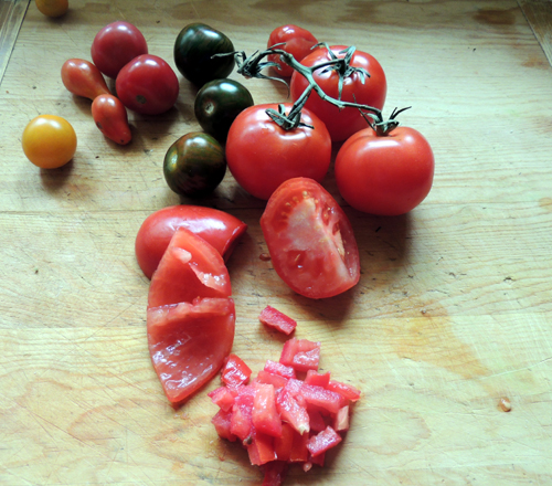 gather tomatoes, slice into halves