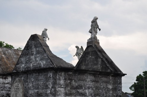 Collapsed tomb roofs with angels above
