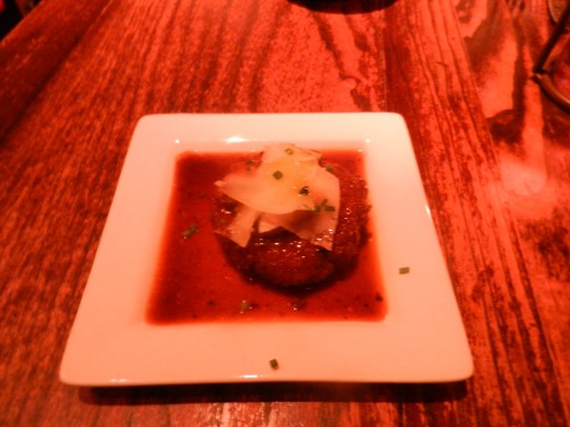 Croquetas de Hongos: Risotto and mushroom croquette with truffle oil, mushroom sauce, and shaved manchego cheese