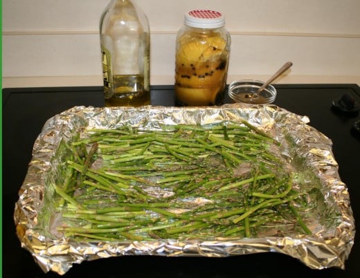 Olive oil, Moroccan Preserved Lemon tossed on the baking sheet.  