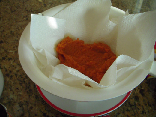 Line a colander with 2 paper towels and drain canned pumpkin for about 5-10 minutes. Removing some of the water from canned pumpkin enhances the pumpkin flavor.