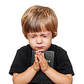 a brainwahed innocent child praying for what he does not understand