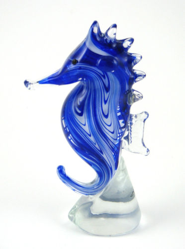 Murano glass sea horse in beautiful striations of blue ranging from royal blue to see blue to a small and elegant swirls of clear glass