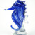 Murano glass sea horse in beautiful striations of blue ranging from royal blue to see blue to a small and elegant swirls of clear glass