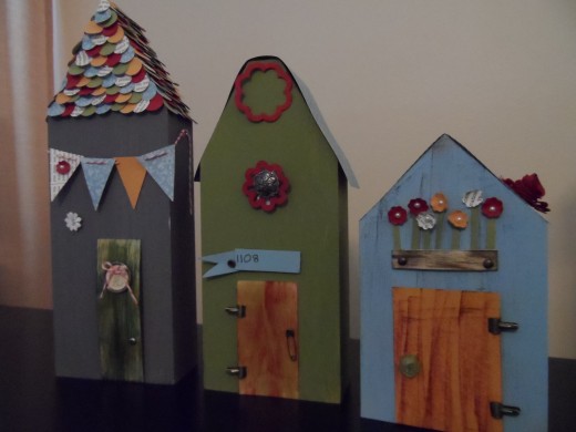 Handcrafted wooden houses with Stampin Up paper and accessories for whimsical theme