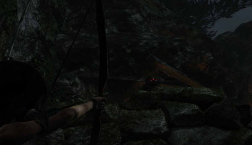Tomb Raider shoot at the enemies from just beneath the rock cropping outside the wolf's cave