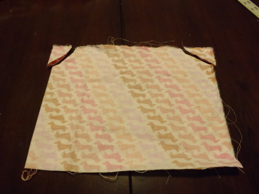 Arm holes for this dress are just simple rounded corners. Don't worry if they're not perfect!